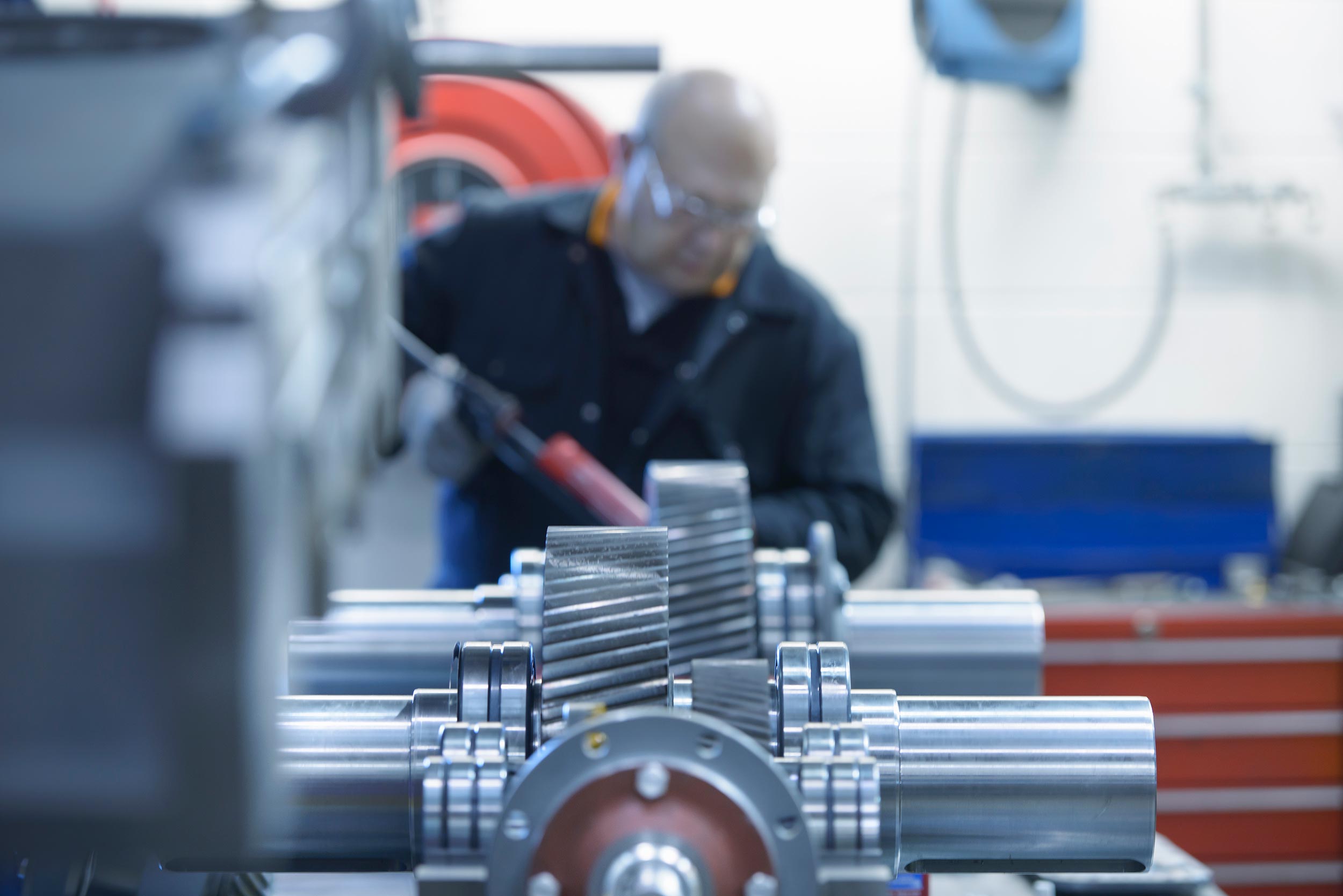 Engineer applying sealant to MOVICON industrial gearbox
